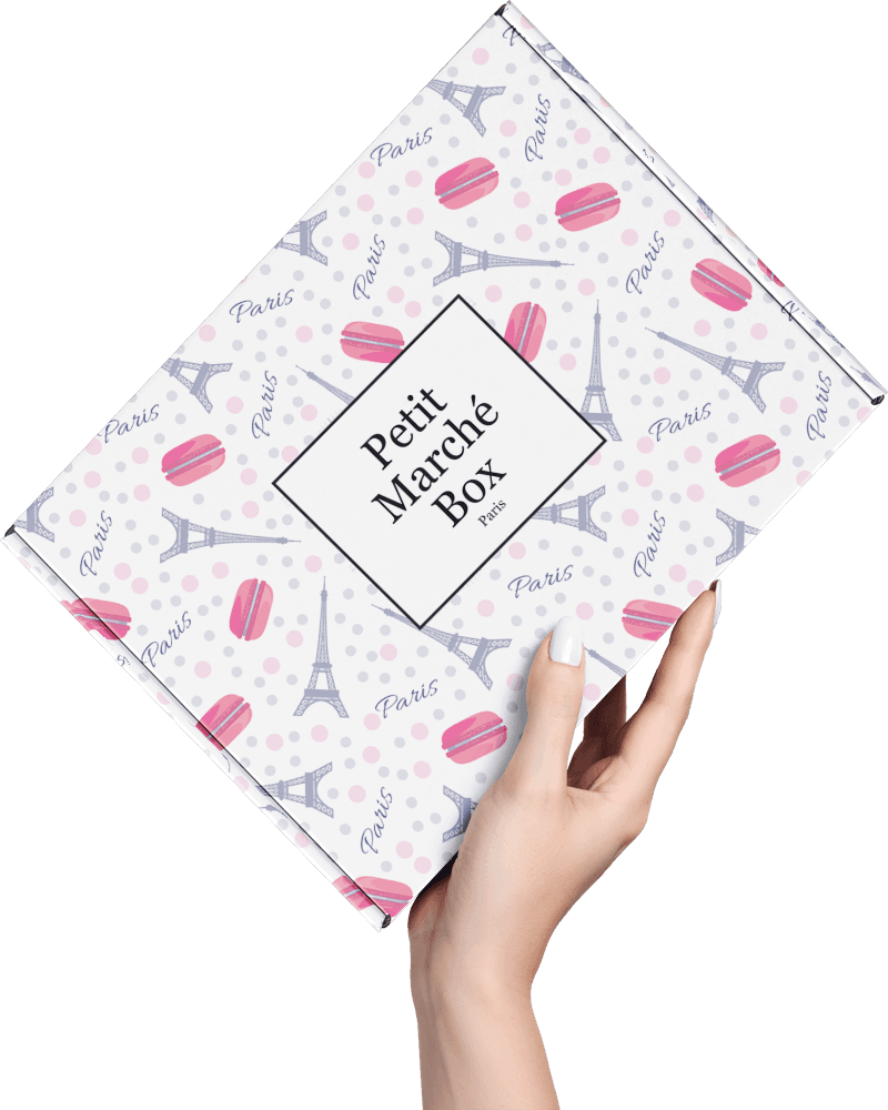 Hand holding a Petit Marche Box